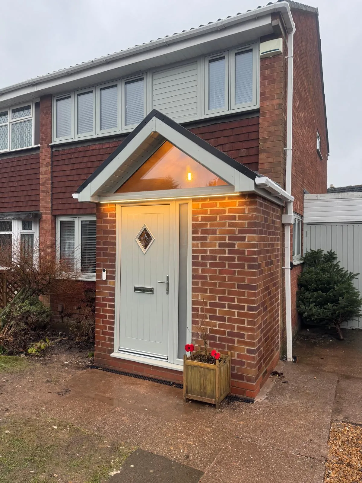 A small brick house with a white door.